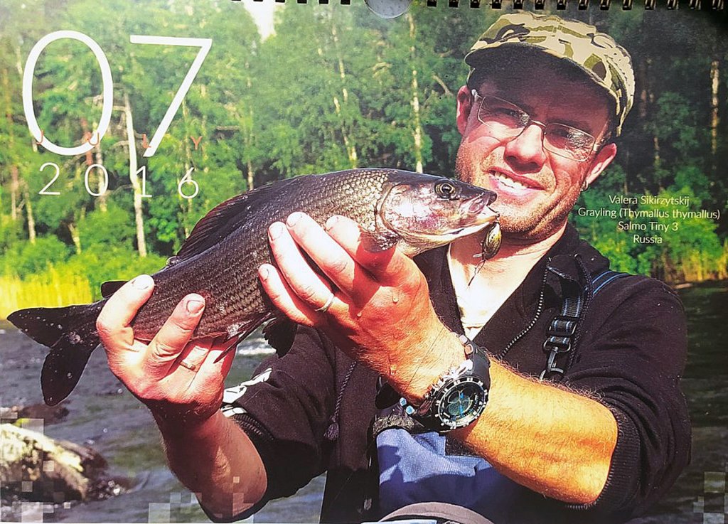 Валерий Сикиржицкий с хариусом на календаре Валерий Сикиржицкий с хариусом на календаре